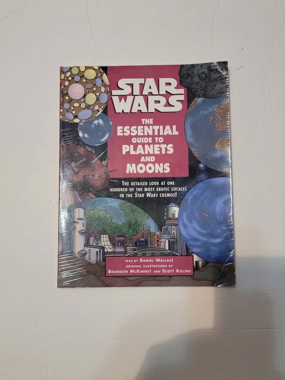 Star Wars The Essential Guide to Planets and Moons - Pink and Blue Cover